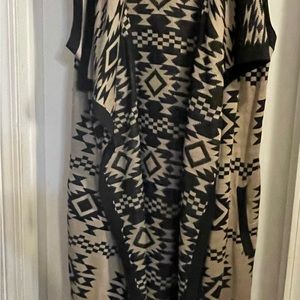 Black and tan long cardigan, sleeveless with 2 flat side pockets